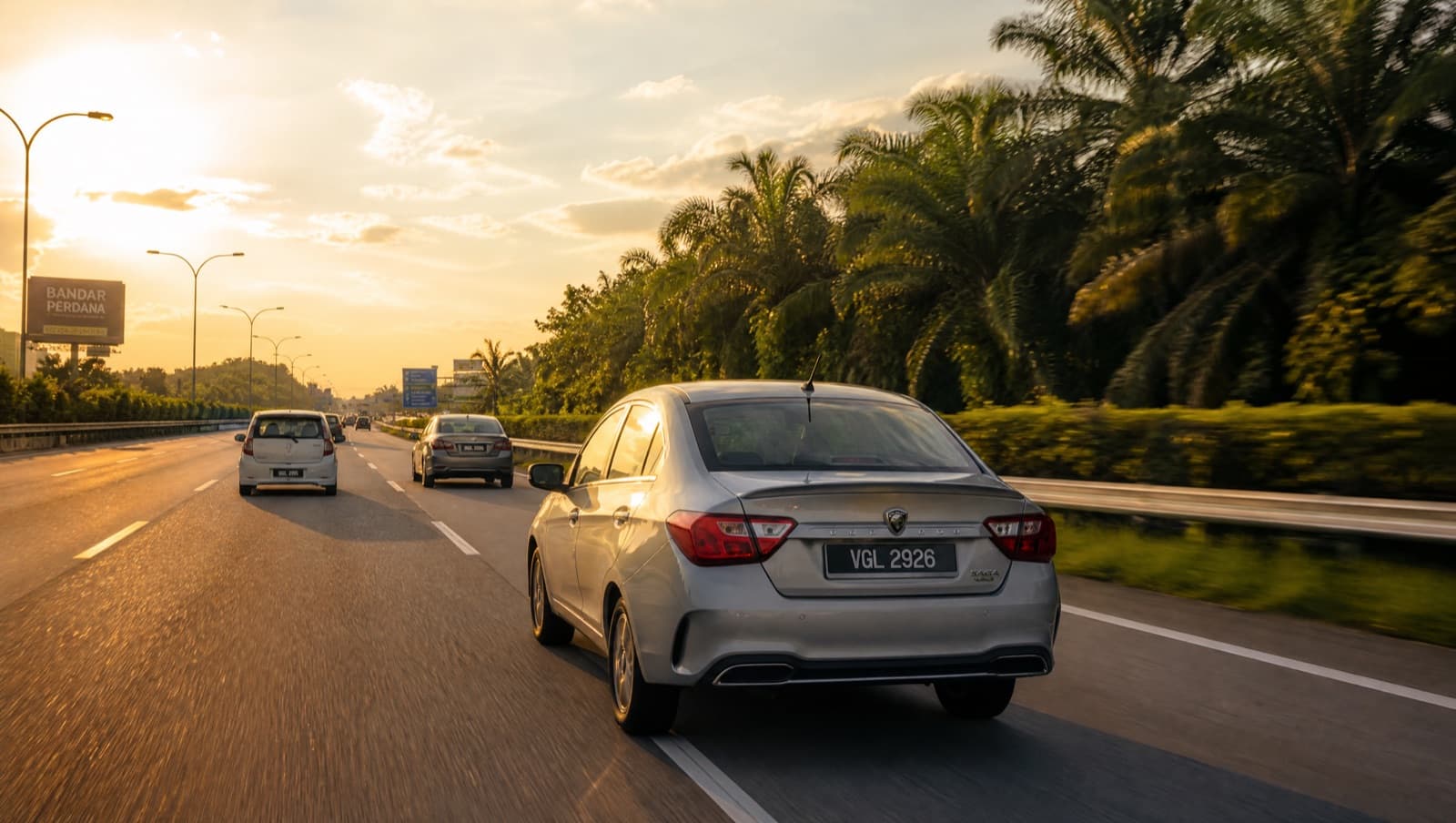 Cars on a Malaysian highway at golden hour